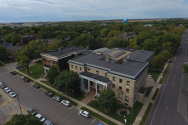 Drone shot of Salveson Hall, Thorson, Voss Hall, Nilssen-Boe and the Atrium with rest of campus in the background